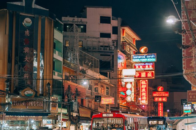 Crowds, signs and street traffic on Khaosan Road at night