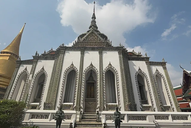 Ornate white and gold architecture inside Bangkok's Grand Palace