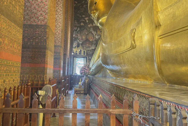 Golden Reclining Buddha filling its hall at Wat Pho in Bangkok