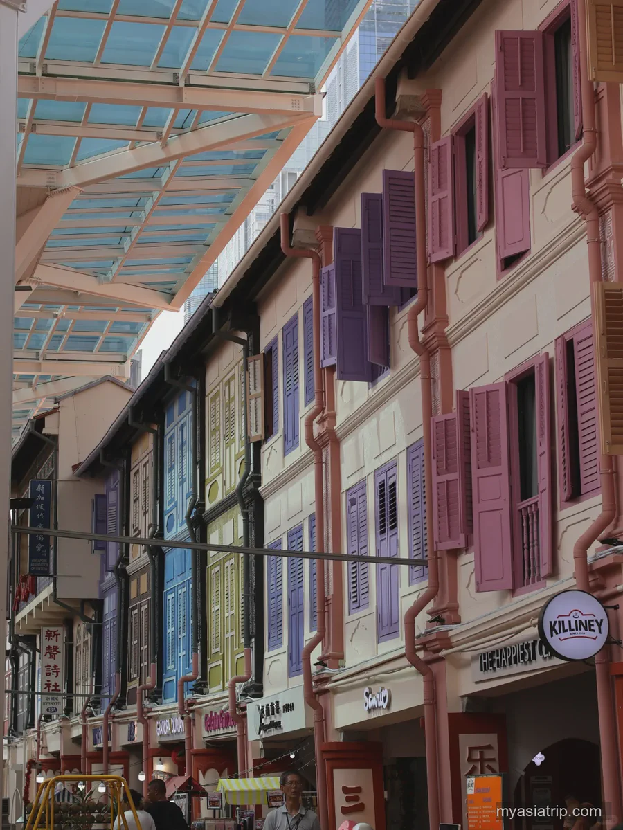 Pastel shophouses with traditional shutters in Singapore Chinatown
