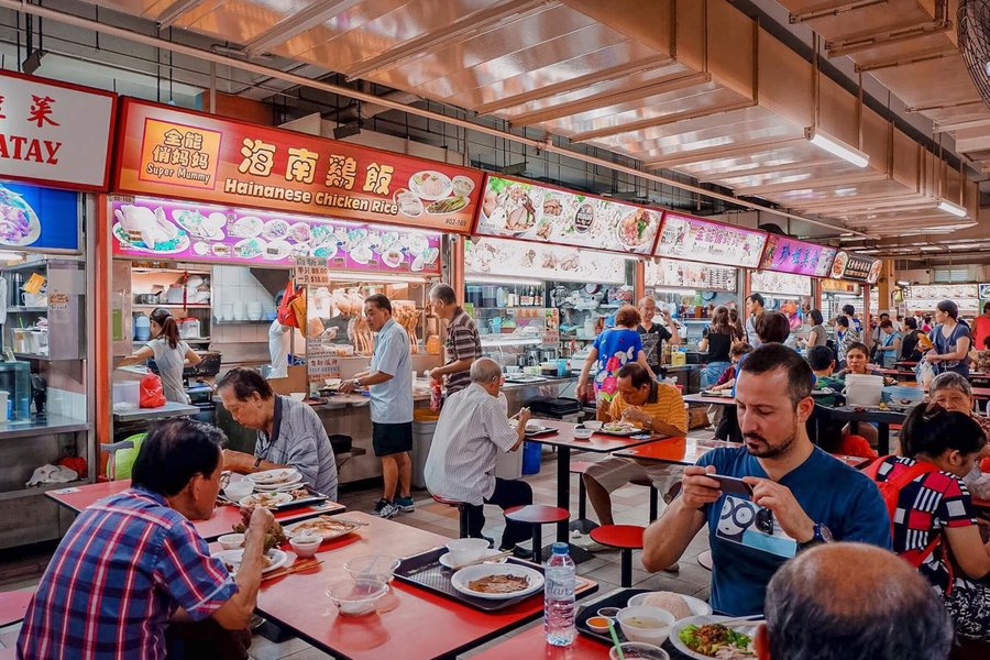A lively communal dining area in a Singapore hawker centre